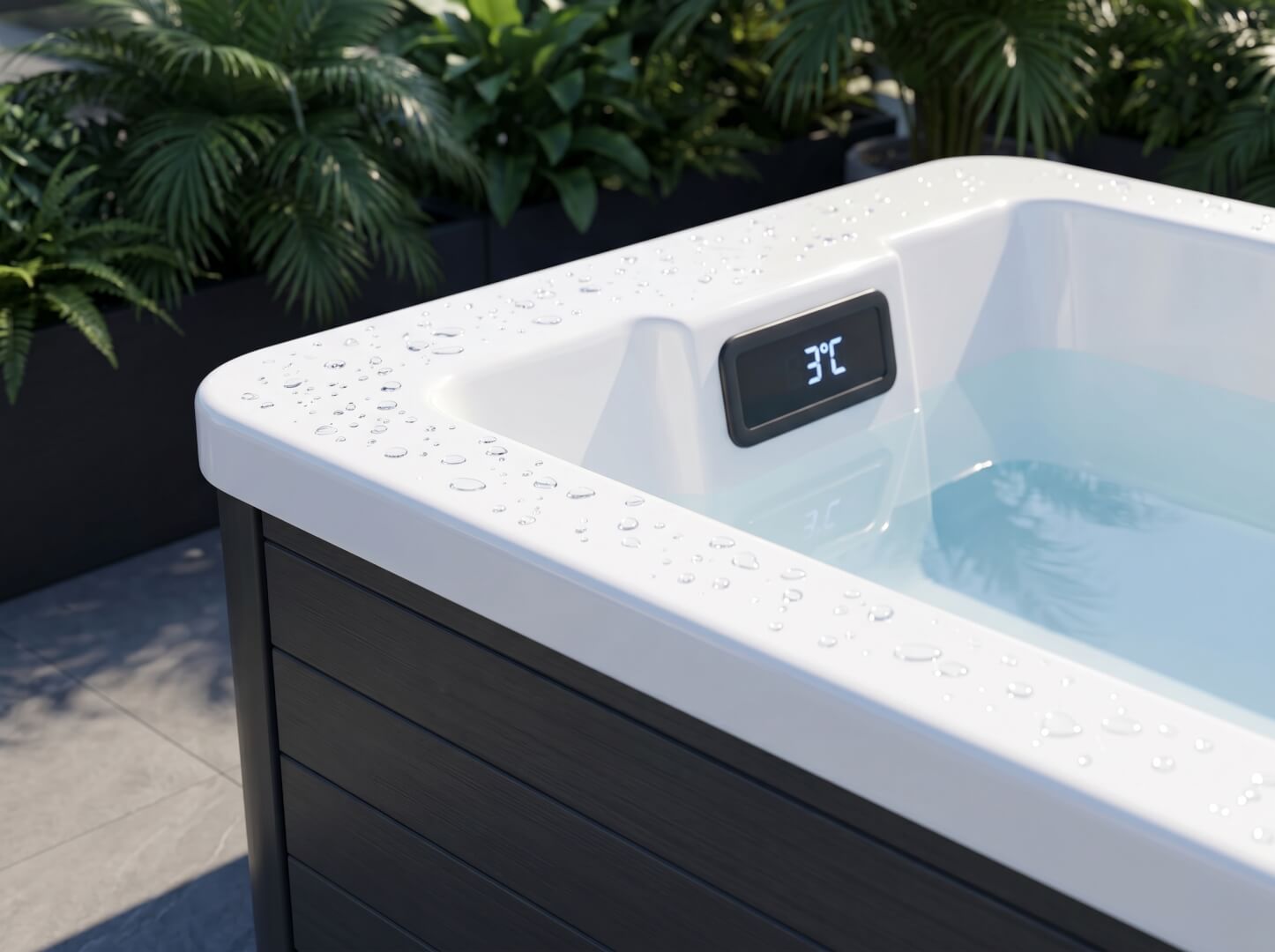 Digital display showing 3°C on the white Aristech acrylic rim of The Basin cold plunge tub — OxiusPro