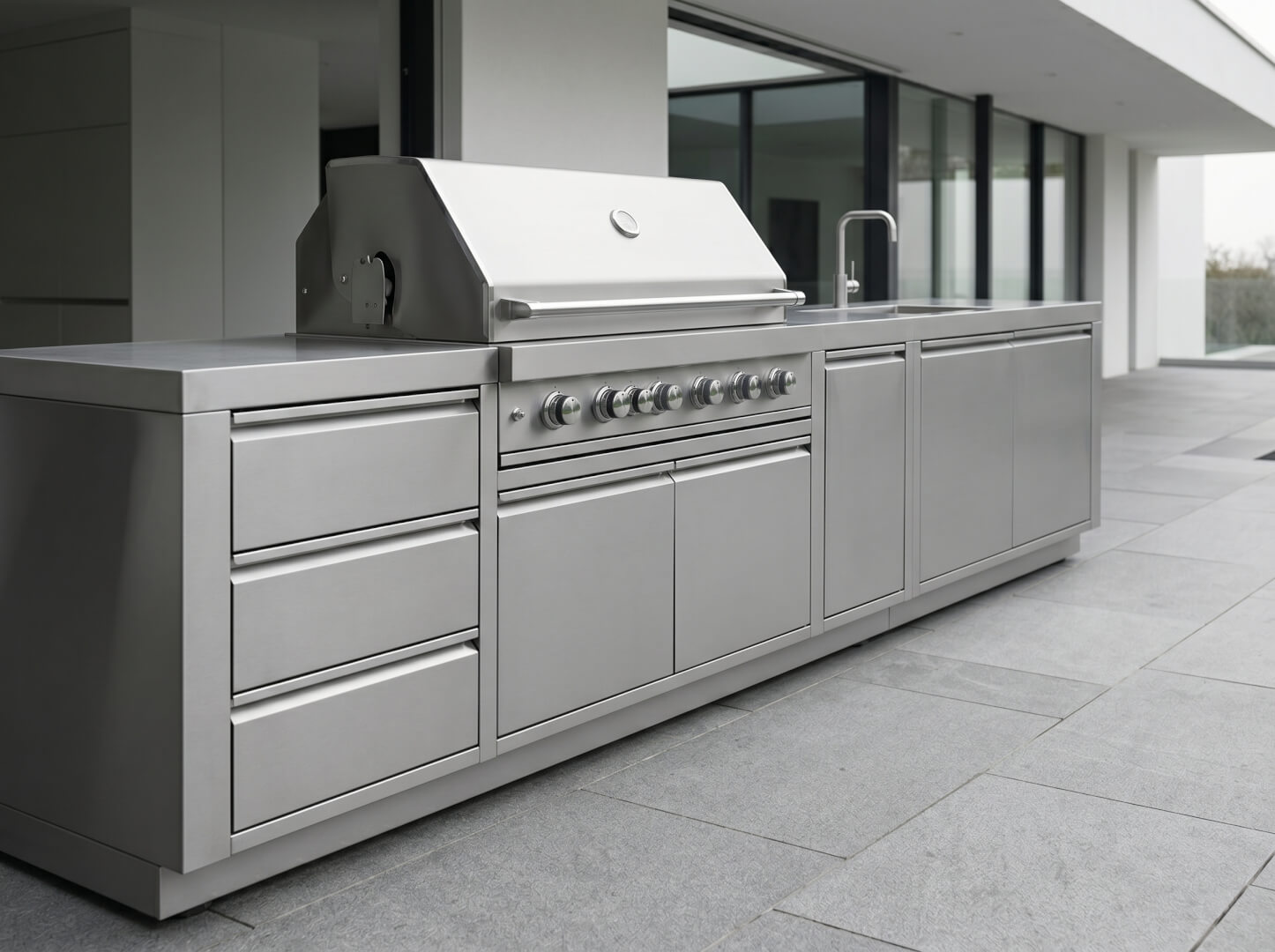 The Hearth outdoor kitchen showing full 5-module modular configuration in brushed stainless steel — OxiusPro