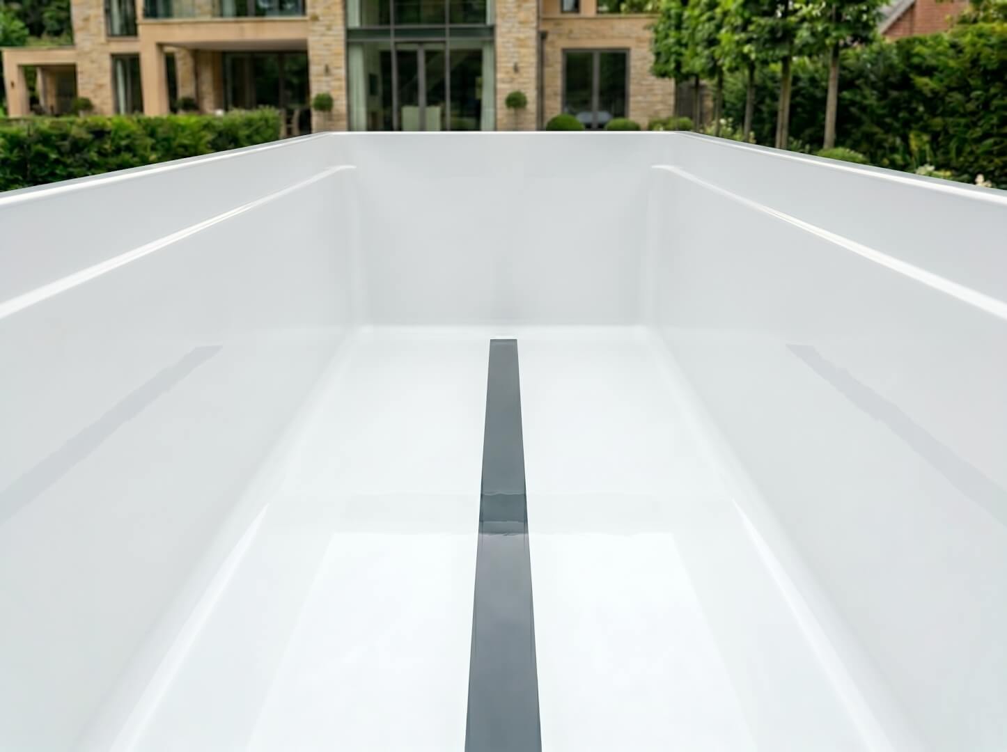 Spa seating zone of The Tide swim spa showing hydrotherapy jets and integrated LED lighting — OxiusPro